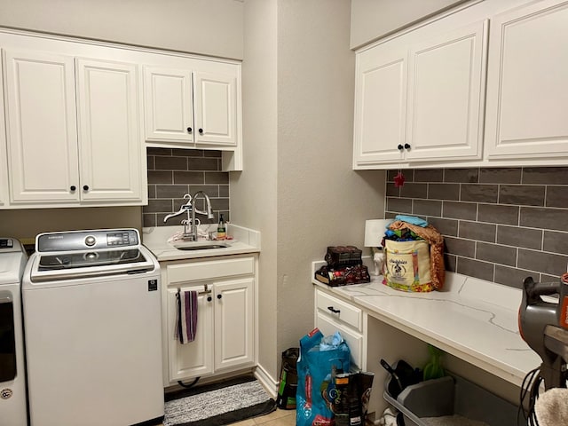 5 Muirfield Dr, Odessa, TX 79762 - washroom with independent washer and dryer, cabinet space, and a textured wall