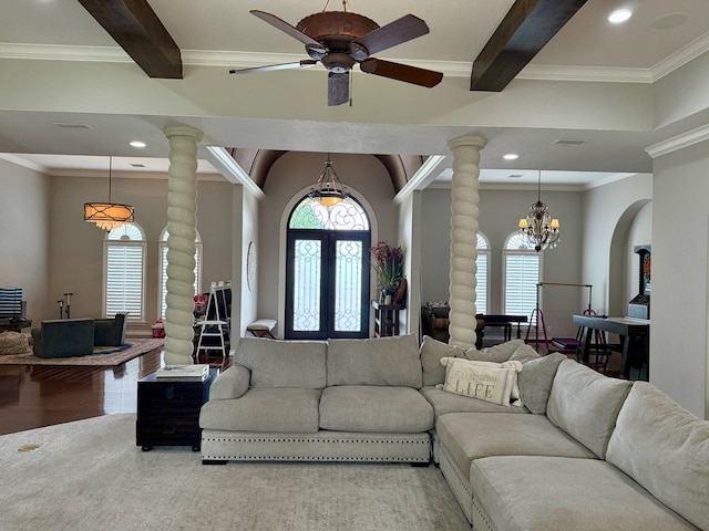 5 Muirfield Dr, Odessa, TX 79762 - living area with ornate columns, healthy amount of natural light, beamed ceiling, a chandelier, and ornamental molding