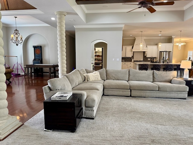 5 Muirfield Dr, Odessa, TX 79762 - living room featuring a ceiling fan, ornamental molding, arched walkways, recessed lighting, and wood finished floors