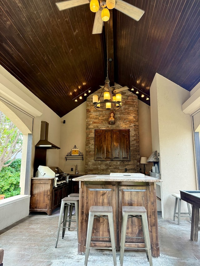 5 Muirfield Dr, Odessa, TX 79762 - view of patio / terrace featuring an outdoor kitchen, a ceiling fan, and a large fireplace
