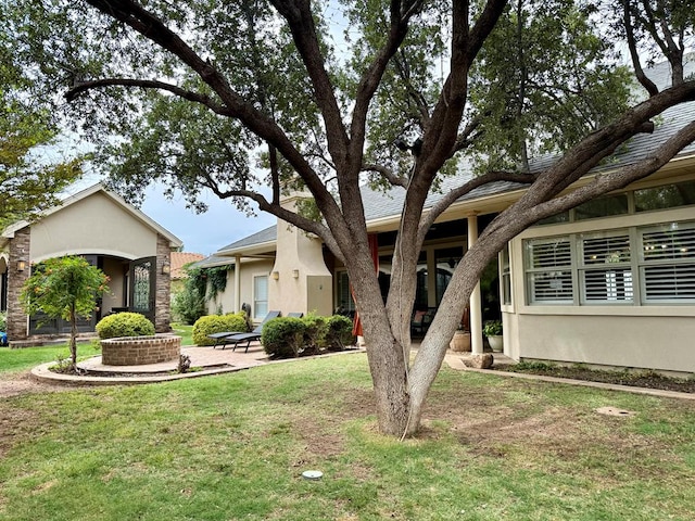 5 Muirfield Dr, Odessa, TX 79762 - view of front facade featuring a front lawn and stucco siding