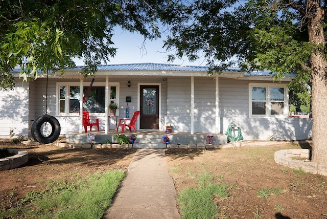 700 NE 2nd St, Andrews, TX 79714 - ranch-style home with covered porch and a metal roof