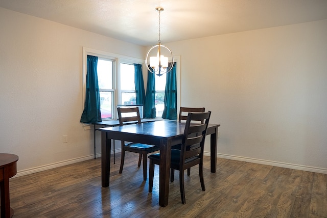 700 NE 2nd St, Andrews, TX 79714 - dining space featuring a chandelier and dark wood-type flooring