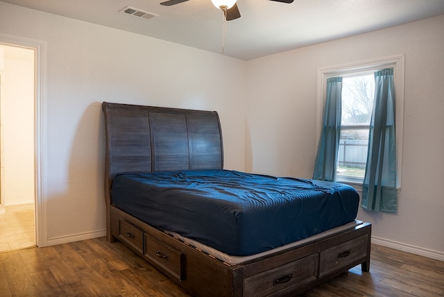 700 NE 2nd St, Andrews, TX 79714 - bedroom with dark wood-style flooring and a ceiling fan