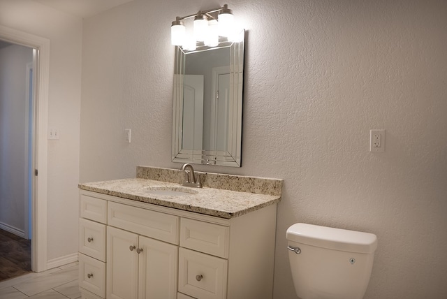 700 NE 2nd St, Andrews, TX 79714 - bathroom featuring vanity and toilet