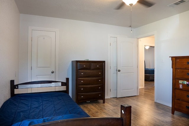 700 NE 2nd St, Andrews, TX 79714 - bedroom with wood finished floors and ceiling fan