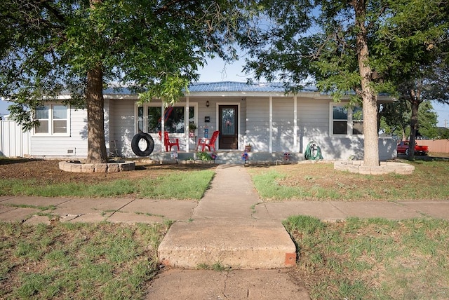 700 NE 2nd St, Andrews, TX 79714 - single story home featuring a porch and a metal roof