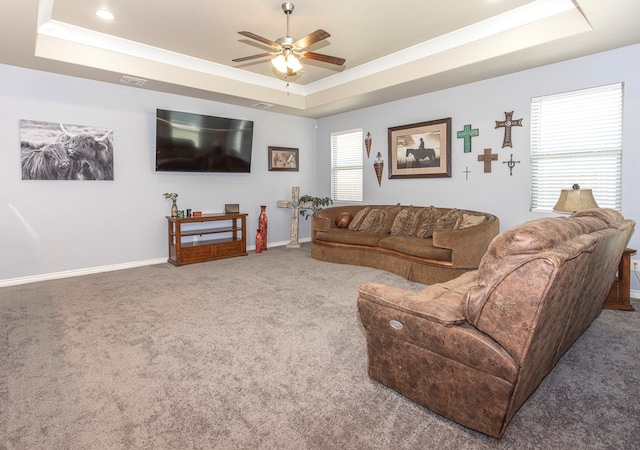 2004 Boise Dr, Odessa, TX 79762 - carpeted living area with a tray ceiling, ceiling fan, and baseboards