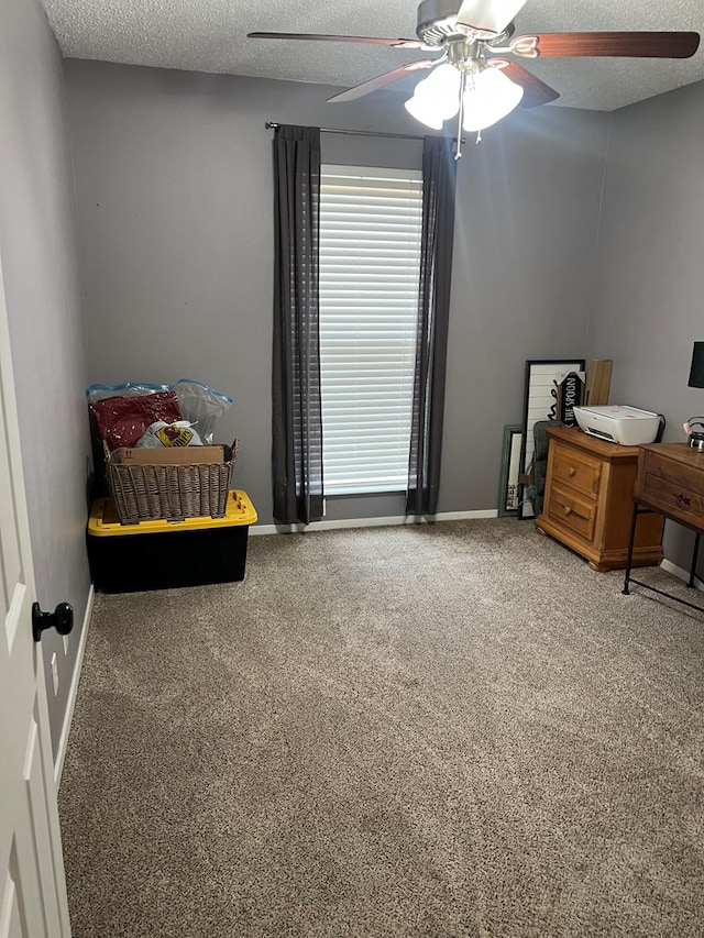 108 Horsehead, Crane, TX 79731 - bedroom with carpet, a textured ceiling, and ceiling fan