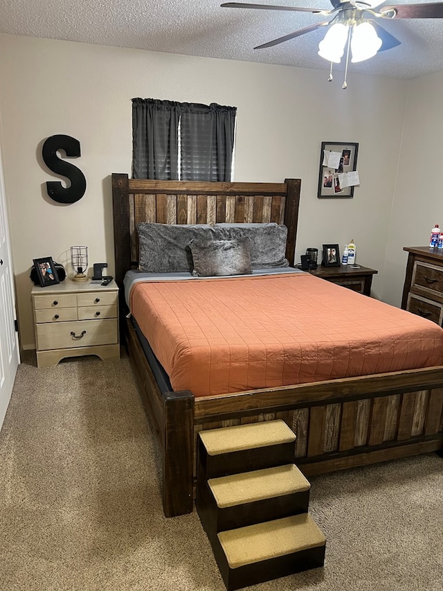 108 Horsehead, Crane, TX 79731 - bedroom with carpet, a ceiling fan, and a textured ceiling