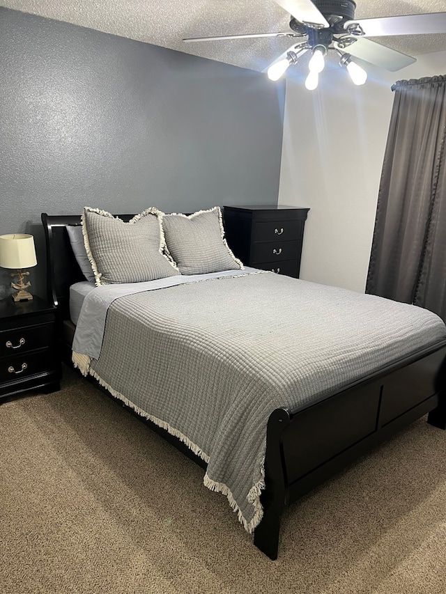 108 Horsehead, Crane, TX 79731 - carpeted bedroom featuring a ceiling fan and a textured wall