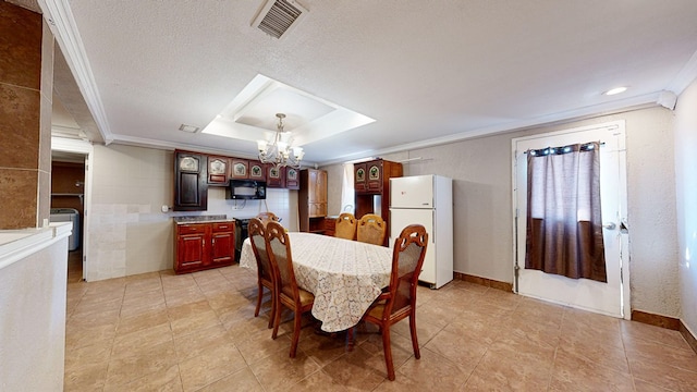 dining room featuring a textured ceiling, ornamental molding, tile walls, and a notable chandelier