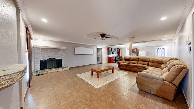 living room featuring a fireplace, ceiling fan, and ornamental molding