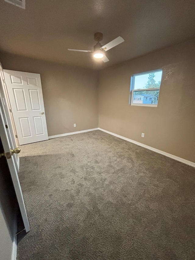 314 SW 11th Pl, Andrews, TX 79714 - spare room with ceiling fan, carpet floors, and baseboards
