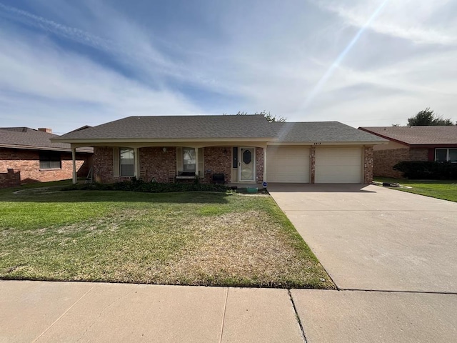 4605 Redbud Ave, Odessa, TX 79762 - ranch-style house with an attached garage, a front lawn, concrete driveway, and brick siding