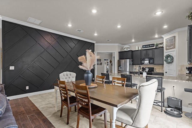 800 94th, Odessa, TX 79765 - dining area featuring ornamental molding, recessed lighting, and a decorative wall