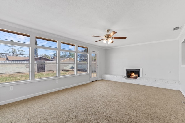 2616 E 21st St, Odessa, TX 79761 - unfurnished living room with crown molding, carpet, healthy amount of natural light, and a ceiling fan