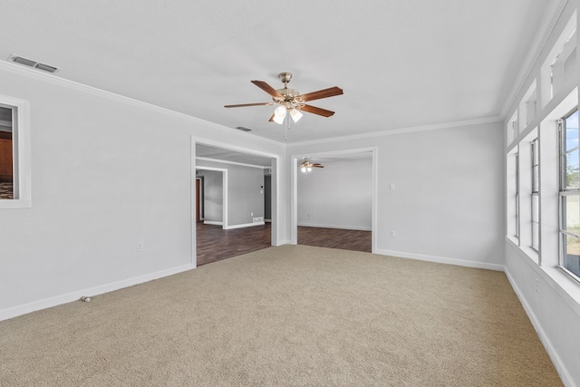 2616 E 21st St, Odessa, TX 79761 - empty room with carpet flooring, a ceiling fan, ornamental molding, and baseboards