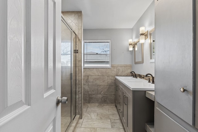 2616 E 21st St, Odessa, TX 79761 - bathroom with vanity, a stall shower, and tile walls