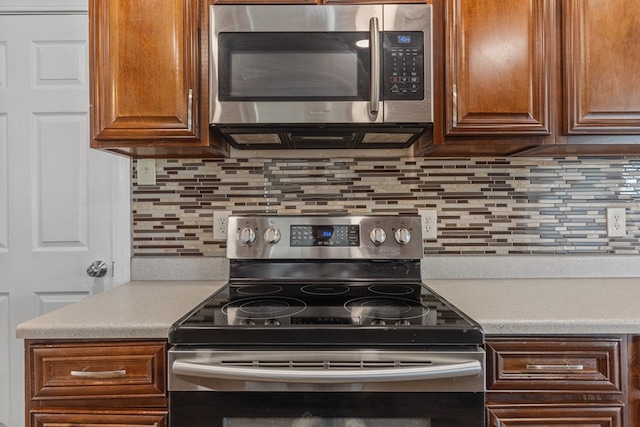 2616 E 21st St, Odessa, TX 79761 - kitchen with stainless steel appliances, light countertops, and tasteful backsplash