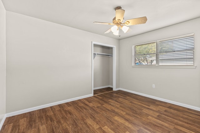 2616 E 21st St, Odessa, TX 79761 - unfurnished bedroom with wood finished floors, baseboards, a closet, and a ceiling fan