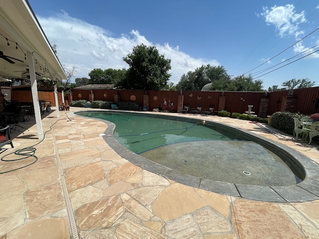 view of swimming pool with a fenced in pool, a fenced backyard, and a patio area