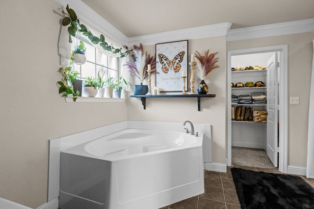 609 E 96th Ct, Odessa, TX 79765 - full bathroom featuring a bath, tile patterned flooring, baseboards, and ornamental molding