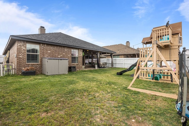 609 E 96th Ct, Odessa, TX 79765 - view of yard featuring a playground, a patio area, and central AC