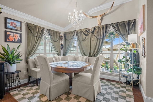 609 E 96th Ct, Odessa, TX 79765 - dining space featuring a chandelier, baseboards, crown molding, and vaulted ceiling