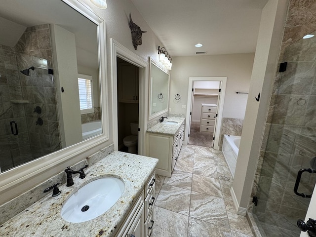 1205 Silverton Dr, Midland, TX 79705 - bathroom with a shower stall, two vanities, a garden tub, and marble finish flooring