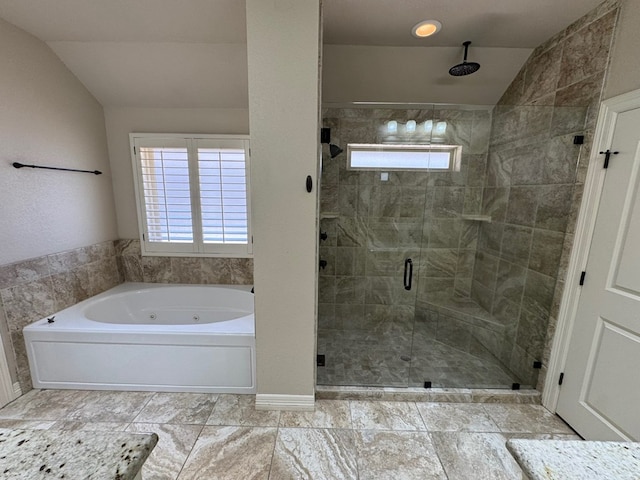 1205 Silverton Dr, Midland, TX 79705 - full bathroom featuring vaulted ceiling, a whirlpool tub, a stall shower, and plenty of natural light