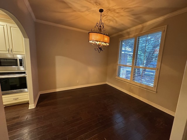 1205 Silverton Dr, Midland, TX 79705 - unfurnished dining area featuring arched walkways, a chandelier, dark wood finished floors, and crown molding