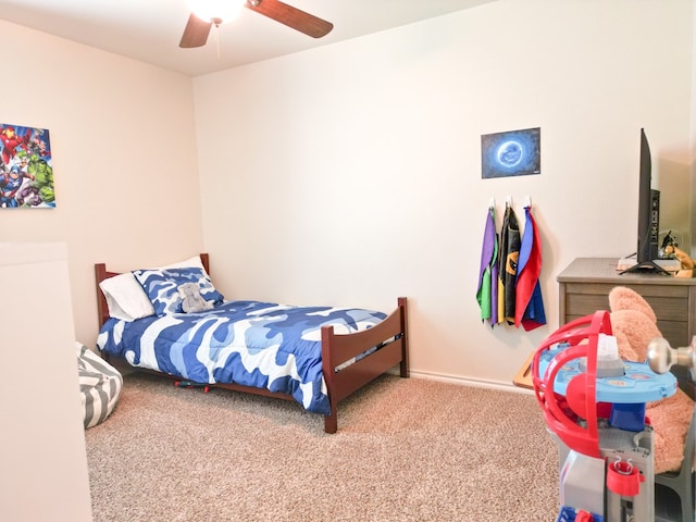 bedroom featuring baseboards, carpet, and ceiling fan