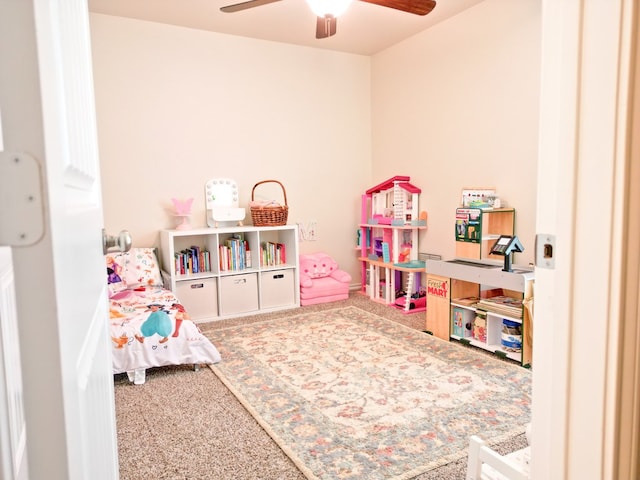 game room with a ceiling fan and carpet flooring