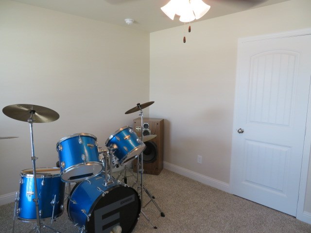 1812 Masquerade Blvd, Odessa, TX 79765 - miscellaneous room with ceiling fan, carpet flooring, and baseboards