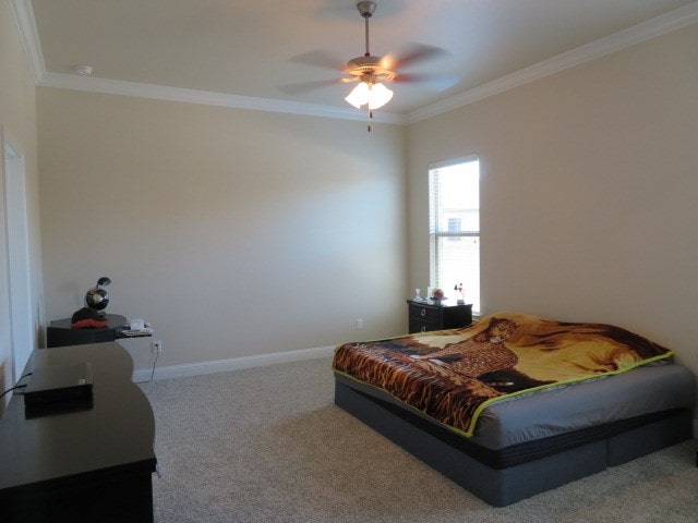 1812 Masquerade Blvd, Odessa, TX 79765 - carpeted bedroom with ornamental molding, baseboards, and ceiling fan
