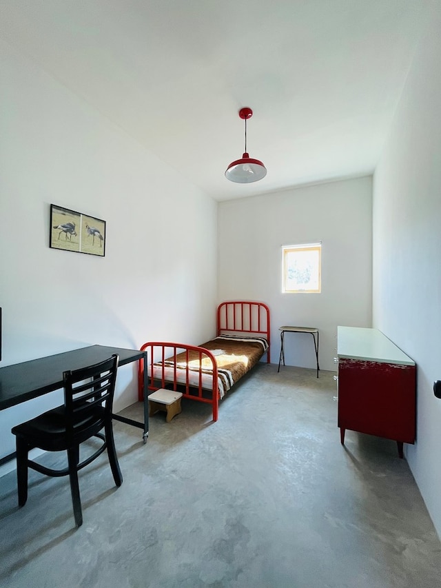 702 E Washington St, Marfa, TX 79843 - bedroom with concrete floors