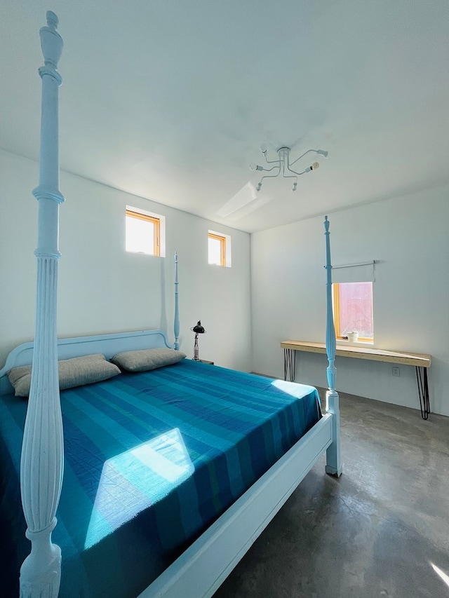 702 E Washington St, Marfa, TX 79843 - bedroom with concrete flooring