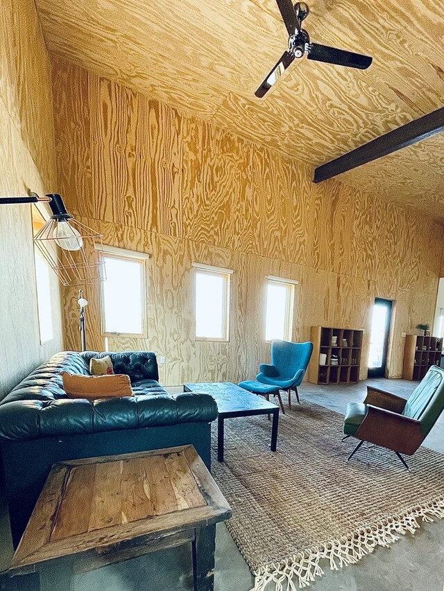 702 E Washington St, Marfa, TX 79843 - interior space featuring a ceiling fan and wooden walls