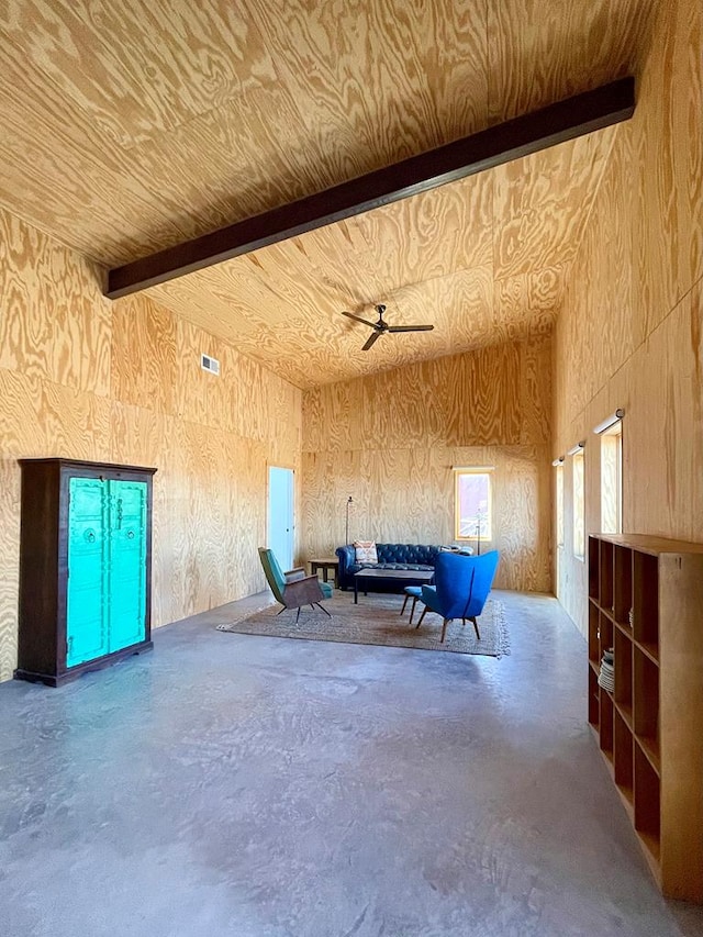 702 E Washington St, Marfa, TX 79843 - miscellaneous room featuring a ceiling fan, beamed ceiling, concrete floors, and high vaulted ceiling