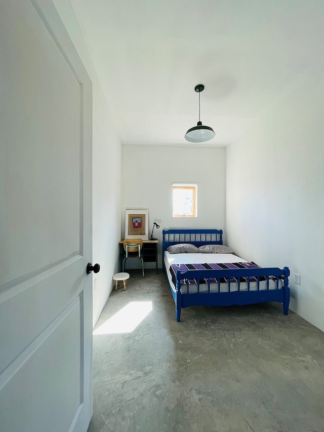 702 E Washington St, Marfa, TX 79843 - bedroom with unfinished concrete floors