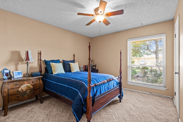 1324 Pagewood Ave, Odessa, TX 79761 - bedroom with a textured ceiling, light carpet, and ceiling fan