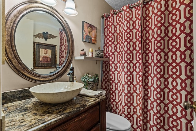 1324 Pagewood Ave, Odessa, TX 79761 - bathroom featuring vanity and a textured ceiling