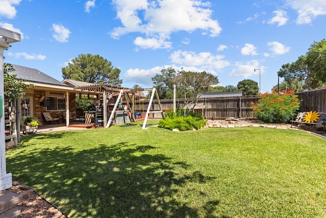 1324 Pagewood Ave, Odessa, TX 79761 - fenced backyard featuring a playground and a patio