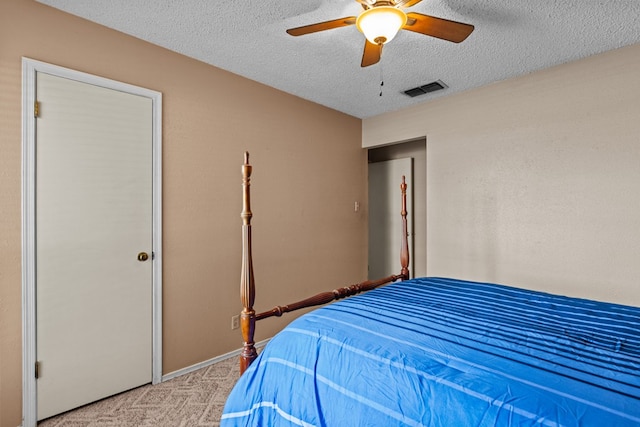 1324 Pagewood Ave, Odessa, TX 79761 - bedroom featuring light carpet, a textured ceiling, and a ceiling fan