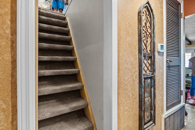 1324 Pagewood Ave, Odessa, TX 79761 - staircase featuring a textured wall