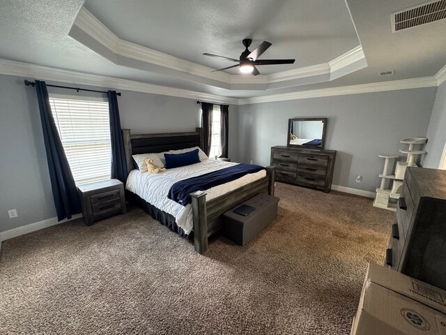 616 96th St, Odessa, TX 79765 - carpeted bedroom featuring a raised ceiling, multiple windows, crown molding, and ceiling fan
