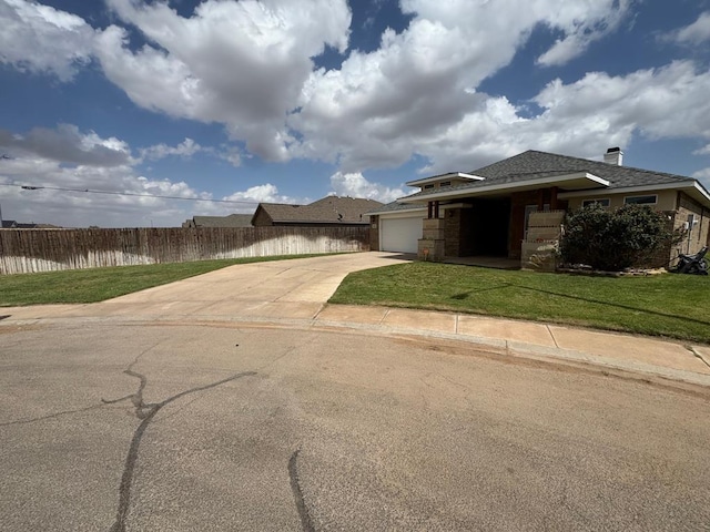 616 96th St, Odessa, TX 79765 - view of front of property with driveway, an attached garage, and roof with shingles