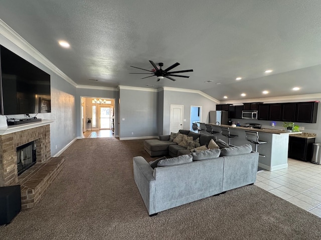 616 96th St, Odessa, TX 79765 - living room with recessed lighting, a ceiling fan, crown molding, a textured ceiling, and a brick fireplace