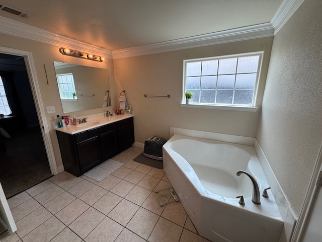 616 96th St, Odessa, TX 79765 - full bath with ornamental molding, double vanity, a garden tub, plenty of natural light, and tile patterned flooring